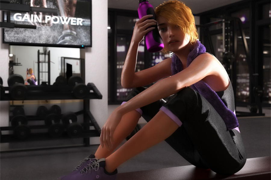 Frau sitzt auf dem Boden eines Fitnessstudios und macht Pause